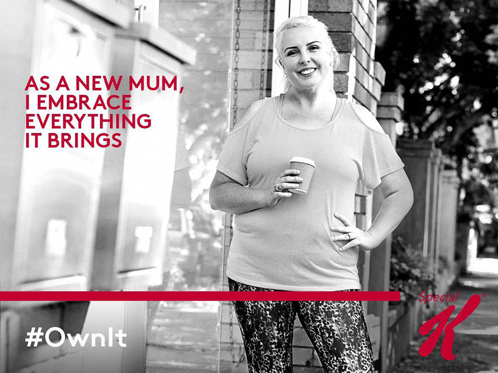 Special K advertisement poster showing a woman in casual clothes with the words 'As a new mum I embrace everything it brings'um in t-shirt and leggings
